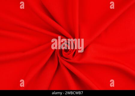 Schwarzer roter Satin dunkler Stoff Textur luxuriös glänzend, das ist abstrakte Seidenstoff Hintergrund mit Mustern weiche Wellen verschwimmen schön. Stockfoto
