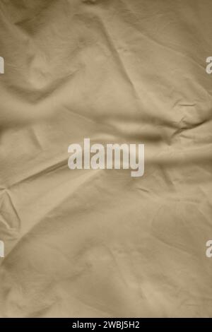 Vintage-Stoff in Nahaufnahme mit Falten und gebranntem Muster. Stockfoto