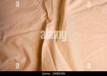 Großansicht aus elegantem, weichem Stoff in Hellorange Stockfoto