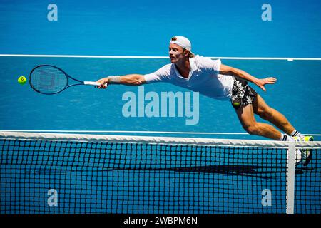 Melbourne, Australien. Januar 2024. Australischer Dane Sweeny, der während eines Qualifikationsspiels der Männer in der dritten und letzten Runde zwischen Belgier Bergs und Australian Sweeny bei der Qualifikation des Grand Slam-Tennisturniers der Australian Open am Freitag, den 12. Januar 2024 in Melbourne Park, Australien, gezeigt wurde. Die Ausgabe 2024 des Australian Grand Slam findet vom 14. Bis 28. Januar statt. BELGA FOTO PATRICK HAMILTON Credit: Belga News Agency/Alamy Live News Stockfoto