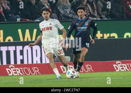 Max Finkgraefe (1. FC Köln, #35) wird durch Kevin Sessa (FC Heidenheim, #16) gezwungen zurueck zu spielen. Fußball: 1. Bundesliga, Saison 2023/2024, 17. Spieltag, 1. FC Köln - 1. FC Heidenheim 1846 am 13.01.2024 im RheinEnergieStadion in Köln Wichtiger Hinweis: Gemaess den Vorgaben der DFL Deutsche Fussball Liga bzw. Des DFB Deutscher Fussball-Bund ist es untersagt, in dem Stadion und/oder vom Spiel angefertigte Fotoaufnahmen in Form von Sequenzbildern und/oder videoaehnlichen Fotostrecken zu verwerten bzw. Verwerten zu lassen. Foto: Kirchner-Media/TH Stockfoto