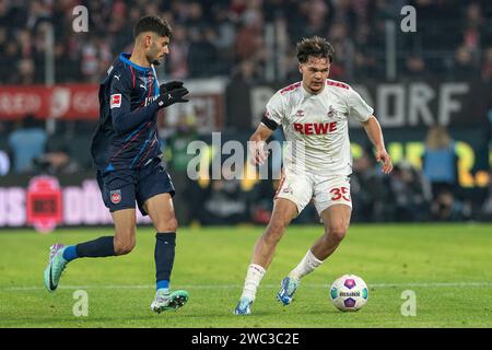 ZWEIKAMPF zwischen Eren Dinkci (FC Heidenheim, #08) und Max Finkgraefe (1. FC Köln, #35). Fußball: 1. Bundesliga, Saison 2023/2024, 17. Spieltag, 1. FC Köln - 1. FC Heidenheim 1846 am 13.01.2024 im RheinEnergieStadion in Köln Wichtiger Hinweis: Gemaess den Vorgaben der DFL Deutsche Fussball Liga bzw. Des DFB Deutscher Fussball-Bund ist es untersagt, in dem Stadion und/oder vom Spiel angefertigte Fotoaufnahmen in Form von Sequenzbildern und/oder videoaehnlichen Fotostrecken zu verwerten bzw. Verwerten zu lassen. Foto: Kirchner-Media/TH Stockfoto