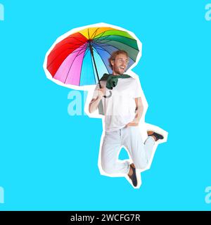 Pop-Art-Poster. Mann mit Regenbogenschirm, der auf hellblauem Hintergrund springt Stockfoto