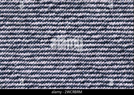 Rückseite der Denim-Oberfläche, blaues Jeansgewebe, von oben. Robustes Baumwollgewebe mit Kettbeschichtung. Art des Textils. Stockfoto