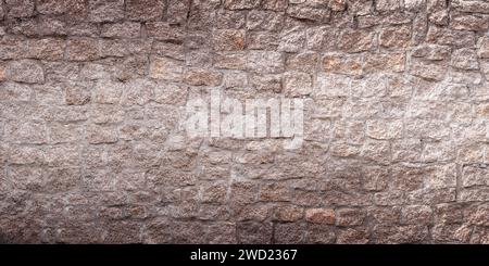 Alter heller Steinmauerhintergrund. Vorderansicht der Steinwand in Großansicht Stockfoto