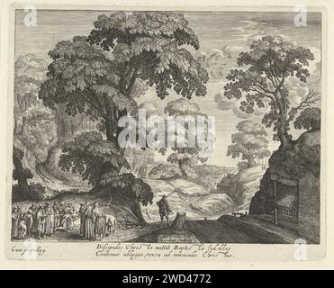 Landschaft mit der Heilung der Blinden, Hendrick Hondius (I), nach Josse van Liere, ca. 1618 drucken Eine baumreiche hügelige Landschaft mit links im Vordergrund Christus, der die Augen eines Blinden berührt, der für ihn auf dem Boden kniet. In der Mitte eine Straße mit einem Mann mit einem Stock über der Schulter. Zwei Zeilen in lateinischer Sprache unter der Vorstellung. Die Haager Papiergravur Heilung eines blinden Mannes: Christus berührt seine Augen mit einer Salbe aus Staub und Spucke (Johannes 9). Landschaften in der gemäßigten Zone Stockfoto