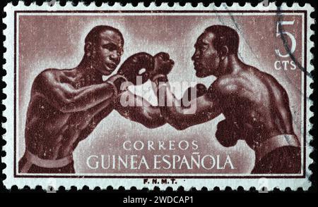 Boxer auf Vintage-Briefmarken von Spanisch-Guinea Stockfoto