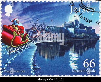 Der Weihnachtsmann und sein fliegende Schlitten auf Briefmarken aus Jersey Stockfoto