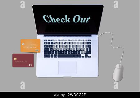 Neben einem Laptop sind zwei Kreditkarten zu sehen, die auf dem Bildschirm in einer 3D-Abbildung über die Online-Verwendung einer Kreditkarte für angezeigt werden Stockfoto