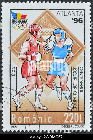 Gestempelte Briefmarke, gedruckt von Rumänien, die Boxen, Olympische Sommerspiele 1996 - Atlanta, um 1996 zeigt. Stockfoto