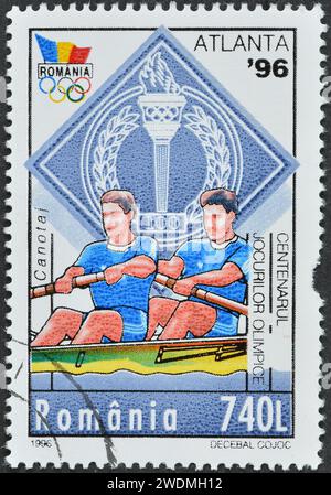 Gestempelte Briefmarke, gedruckt von Rumänien, die Rowng, Olympische Sommerspiele 1996 - Atlanta, um 1996 zeigt. Stockfoto