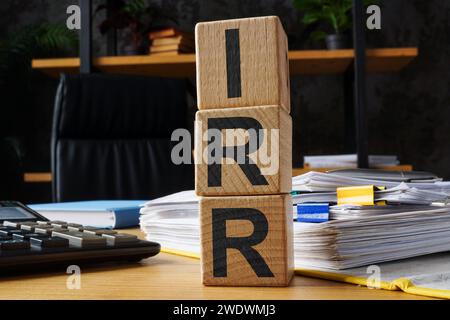 Wooden cubes with abbreviation IRR internal rate of return. Stockfoto