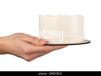 Hand hält leeren einfachen bento-Kuchen, Creme Mockup isoliert auf weiß Stockfoto
