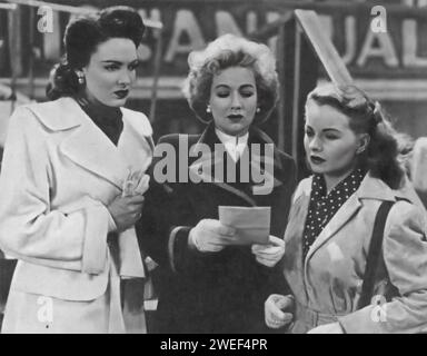 Linda Darnell, Ann Sothern und Jeanne Crain drehen in einem Brief an drei Frauen (1949) unter der Regie von Joseph L. Mankiewicz. In diesem Film spielen die drei Frauen Freunde, deren Ehen in Frage gestellt werden, wenn sie jeweils einen Brief von einem gemeinsamen Bekannten erhalten, in dem sie behaupten, sie sei mit einem ihrer Ehemänner davongelaufen. Stockfoto