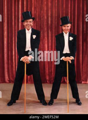 Vera-Ellen und Fred Astaire spielen in „Three Little Words“ (1950), einem musikalischen Biopic. In diesem Film spielt Astaire den Songwriter Bert Kalmar, während Vera-Ellen Jessie Brown, Kalmars Partnerin und später seine Frau, darstellt. Der Film erzählt die Karriere von Kalmar und seinem Komponierpartner Harry Ruby, gespielt von Red Skelton, und zeigt eine Reihe von musikalischen Nummern, die Astaire und Vera-Ellen außergewöhnliche Tanzfertigkeiten hervorheben. Stockfoto