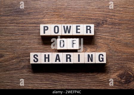 Power of Sharing – Wortkonzept auf Bausteinen, Text Stockfoto