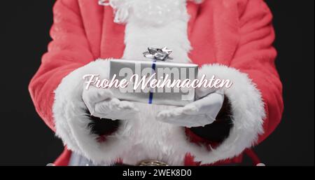Frohe weihnachten Text in weiß über der Mitte des weihnachtsvaters, der ein Geschenk hält Stockfoto