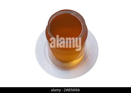 Blütenhonig in einem Glas, isoliert auf weißem Hintergrund Stockfoto