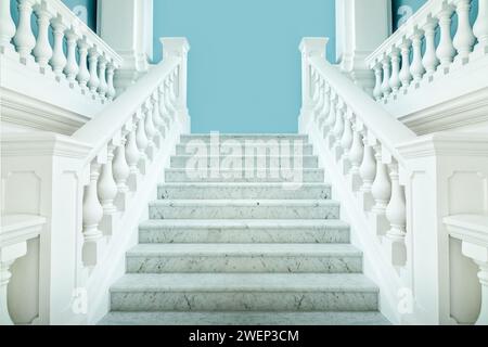 Elegante symmetrische weiße Treppe mit einer blauen Wand dahinter Stockfoto
