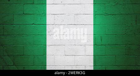 Die Flagge Nigerias ist auf einer Ziegelwand gemalt. Stockfoto