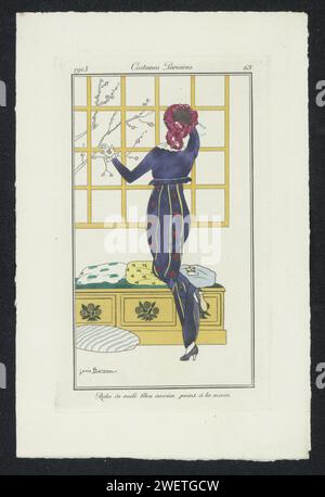 Journal of Ladies and Fashion: The Fashion Illustrators, 1912 - 1914 Magazin Frau im japanischen Stil, auf der Rückseite gesehen, in einem blauen Kleid von Hand bemalt. Papierteller. Kleid, Kleid (+ Damenkleidung) Stockfoto