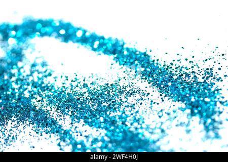 Ein funkelnder Glitzer auf weißem Hintergrund Bokeh Abstract Close Up Blue Stockfoto