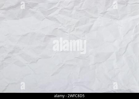 Weißer zerknitterter Papierhintergrund, Struktur alt für Webdesign-Bildschirmschoner. Vorlage für verschiedene Zwecke oder zum Erstellen von Verpackungen. Stockfoto