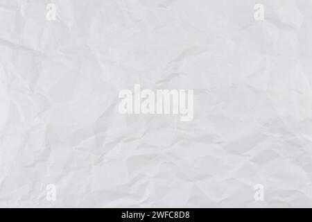 Weißer zerknitterter Papierhintergrund, Struktur alt für Webdesign-Bildschirmschoner. Vorlage für verschiedene Zwecke oder zum Erstellen von Verpackungen. Stockfoto