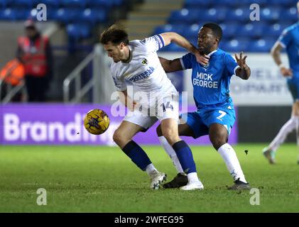 Peterborough, Großbritannien. 30. Januar 2024. Armani Little (AFCW) Jeando Fuchs (PU) beim Spiel Peterborough United gegen AFC Wimbledon EFL Trophy im Weston Homes Stadium, Peterborough, Cambridgeshire, am 30. Januar 2024. Quelle: Paul Marriott/Alamy Live News Stockfoto