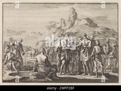 Jozef verkauft an Händler von seinen Brüdern, Jan Luyken, 1704 Druck Amsterdamer Papierätzung während Josephs Brüder essen, kommt eine Karawane von ishmaeliten (Midianiten) Händlern vorbei: Juda schlägt vor, Joseph an sie zu verkaufen Stockfoto