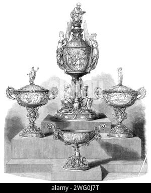 The International Exhibition: The Poetry of Great Britain, eine Gruppe von Silber, entworfen und modelliert von Signor Monti und ausgeführt von Mr. C. F. Hancock, 1862. "Der Name von Herrn Hancock als unternehmungslustiger und diskriminierender Arbeitgeber mit den besten künstlerischen Talenten, die wir bekommen können, ist uns seit langem wohlbekannt; aber wir glauben, dass er selten glücklicher war als die Dienste von Signor Monti bei der Gestaltung und Modellierung dieser wichtigen Werke, die Szenen von einigen der größten englischen Dichter in einer Weise darstellen, die der Quelle, die sie inspiriert hat, nicht unwürdig ist. T Stockfoto