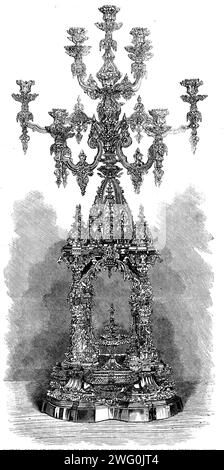 The International Exhibition: Candelabrum von Messrs. Garrard für seine Hoheit der Maharajah Dhuleep Singh, 1862. Der Stil ist rein Hindoo, jeder Kerzenleuchter stellt einen Pavillonbrunnen dar, in dem die vier Hauptgottheiten vorgestellt werden: Brahma der erste, Vishnu der Pervader, Siva der Zerstörer und Ganessa, der Gott der Weisheit. Der Überbau besteht aus dem eigenartig gewachsenen Turm, der von einem dreifachen Schirm überragt wird, der auf seltsame östliche Weise die Macht des Königs kennzeichnet, über dem der Pfau steht - ein Emblem der Souveränität und Unsterblichkeit... in Tragen Stockfoto