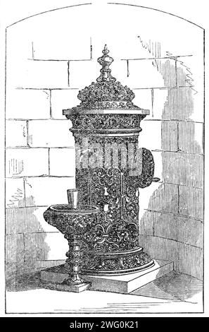 Neuer Trinkbrunnen in Bowness, Windermere, 1862. "Wir präsentieren unseren Lesern eine Gravur eines eigenartigen Trinkbrunnens, die den Besuchern und Bewohnern von Bowness, Windermere, von Joseph Livesey, Esq., aus Preston, präsentiert wurde. der der Stadt Preston acht Trinkbrunnen schenkte. Es liegt an der viel frequentierten und schönen Promenade vor dem Windermere Lake und bildet neben seiner Funktion als Trinkbrunnen ein Ornament von nicht unerheblicher Attraktion. Wir glauben, das ist der erste Brunnen mit mechanischer Anordnung, um das Wasser aus einem niedrigen Niveau zu heben Stockfoto