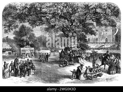 Ehrenamtliche Festveranstaltung von Mr. Harvey, High Sheriff of Norfolk, in Crown Point, nahe Norwich: The Sports, 1862. "...das sports...comprised ein Hürdenrennen für berittene Freiwillige, Fuß- und Schubkarrenrennen, ein Postamt, ein Glücksrad, die Lieder einer Band von Christys Spielfiguren; die Komik der primitivsten unserer dramatischen Darstellungen, Punch und Judy; Beschwörung, Gewölbe, das Klettern von fetten Stangen und eine Vielzahl anderer Vergnügungen... die Feierlichkeiten wurden kurz nach Einbruch der Dunkelheit geschlossen, mit einem herrlichen Feuerwerk von Mr. Tucker in den Cremorne Gardens. So endete ein fe Stockfoto