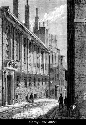 Merchant Taylors' School, Suffolk-Lane, Cannon-Street, City [of London], 1862. Die Merchant Taylors School hat keine Ausstattung, sondern das, was sie dem öffentlichen Geist des Unternehmens verdankt, mit dem sie so eng verbunden ist. Es hat keinen Anspruch... in der allgemeinen Akzeptanz dieses Begriffs als "freie Schule" zu gelten; aber was auch immer es über die Zahlung durch Gelehrte hinaus verlangen mag, wird aus den "allgemeinen Mitteln" des Unternehmens bereitgestellt. Daher ist es in hohem Maße eine unentgeltliche Schule, denn der Unterricht, den sie bietet, ist von einer Klasse, die viel höher ist als die, die man für die c Stockfoto