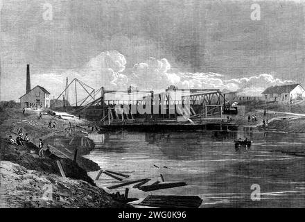 Die Überschwemmung im Fens: Der Siphondamm des mittleren Abflusses, 1862. "Der Einsatz des Siphons ist ein ganz neues Merkmal in der Geschichte der Entwässerung. Sollte das Experiment, das jetzt von Mr. Appold, dem genialen Erfinder der Zentrifugalpumpe, entwickelt und von der Messrs. Leather unter der technischen Aufsicht von Mr. Hawkshaw durchgeführt wurde, einen Erfolg in Sumpfgebieten erweisen, es gibt viele Gründe für die Annahme, dass die Methode des Umgangs mit Drainage-Wasser in Gezeitenkanälen, die nicht für die Navigation benötigt werden, allgemein angenommen wird... es kam Mr. Appold vor, dass, wenn er eine Zahl festlegen könnte Stockfoto