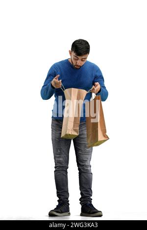 Ein Mann in voller Länge, auf weißem Hintergrund, mit Taschen Stockfoto