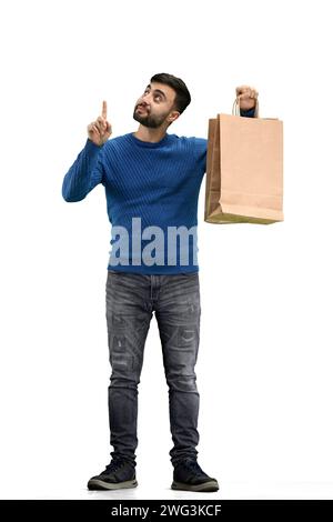 Ein Mann in voller Länge, auf weißem Hintergrund, mit Taschen Stockfoto