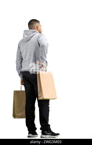 Ein Mann in voller Länge, auf weißem Hintergrund, mit Taschen Stockfoto