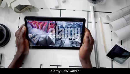 Cctv-Sicherheitsalarm Und Brandüberwachung Auf Tablet Stockfoto
