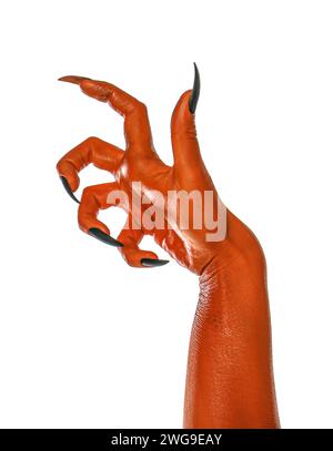 Gruseliges Monster. Orangefarbene Hand mit Krallen isoliert auf weiß Stockfoto