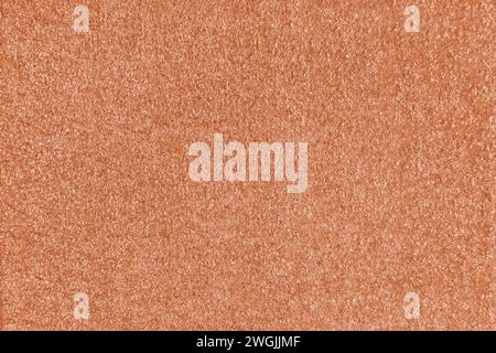 Texturhintergrund aus orangefarbenem Stoff. Polster mit Jacquard-Textur, boucle-Möbel, Textilmaterial, Design-Inneneinrichtung, Einrichtung. Ridge-Textur Stockfoto