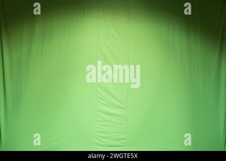 Grüner Hintergrund aus Stoff mit Nähten Stockfoto