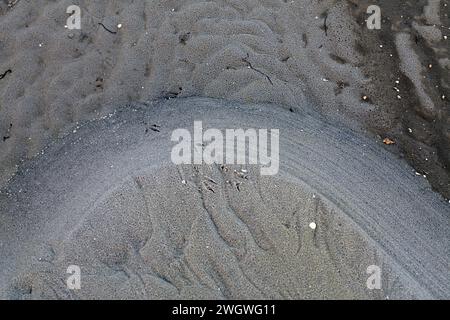 Muster in Sand, Eis, Holz, Stein Stockfoto