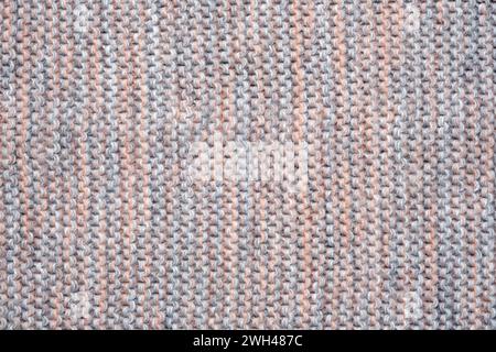 Gestrickter mehrfarbiger Hintergrund aus Wollgarnen. Abstrakte Textur eines Strickstoffs. Stockfoto