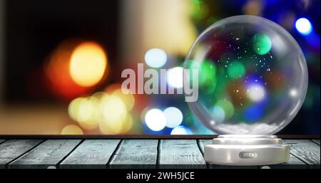 Bild einer weihnachtsschneekugel mit weihnachtsfeenlichtern im Hintergrund Stockfoto