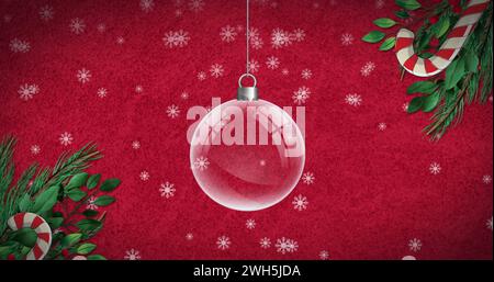 Bild der weihnachtskugel mit Schneefall und weihnachtsdekoration auf rotem Hintergrund Stockfoto