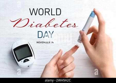 Welt-Diabetes-Tag. Frau mit Lanzettenstift an weißem Holztisch, Nahaufnahme Stockfoto