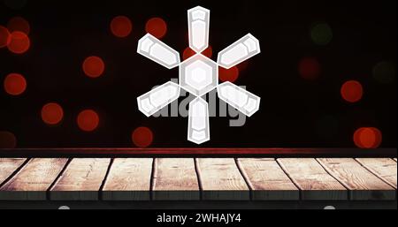 Bild von Schneeflocken-weihnachtsdekorationen auf roten Flecken und hölzernem Hintergrund Stockfoto