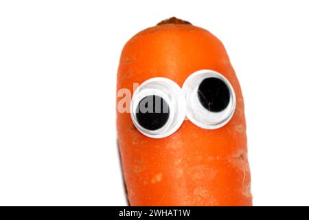 Dummes Essen mit Goggly wackeligen Augen Stockfoto